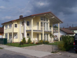 Einfamilienhaus Architektur mit Einliegerwohnung in Wolfratshausen mit harmonikalen Proportionen